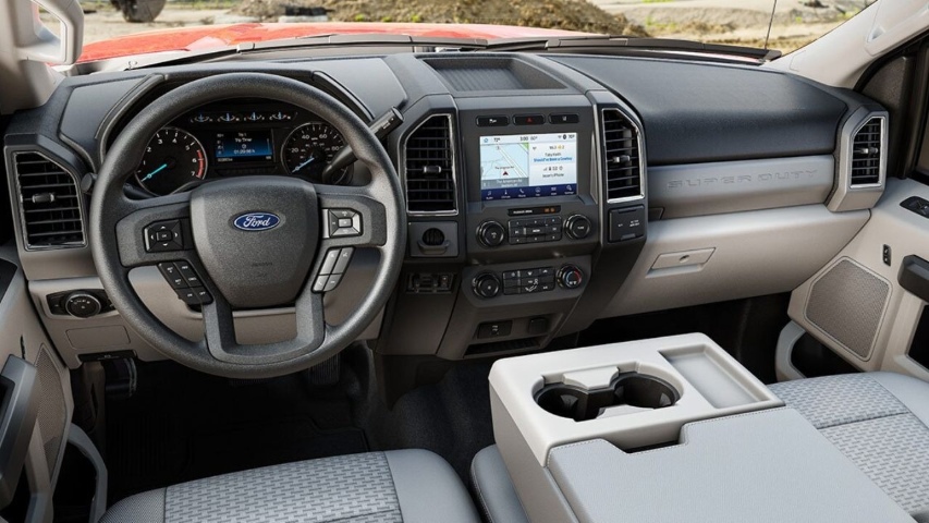 Interior view of 2026 Ford Super Duty showing steering wheel, digital dash, and infotainment system.