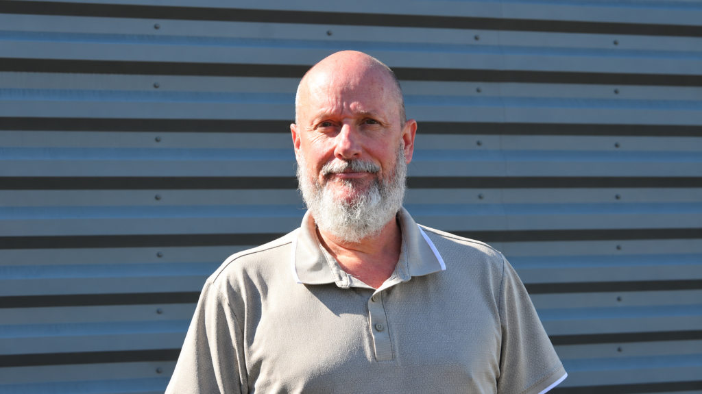 Bearded Man Against Corrugated Steel