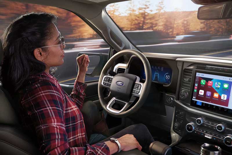 Driver's perspective of the Head-Up Display projected on to the windshield viewing the Ford BlueCruise screen